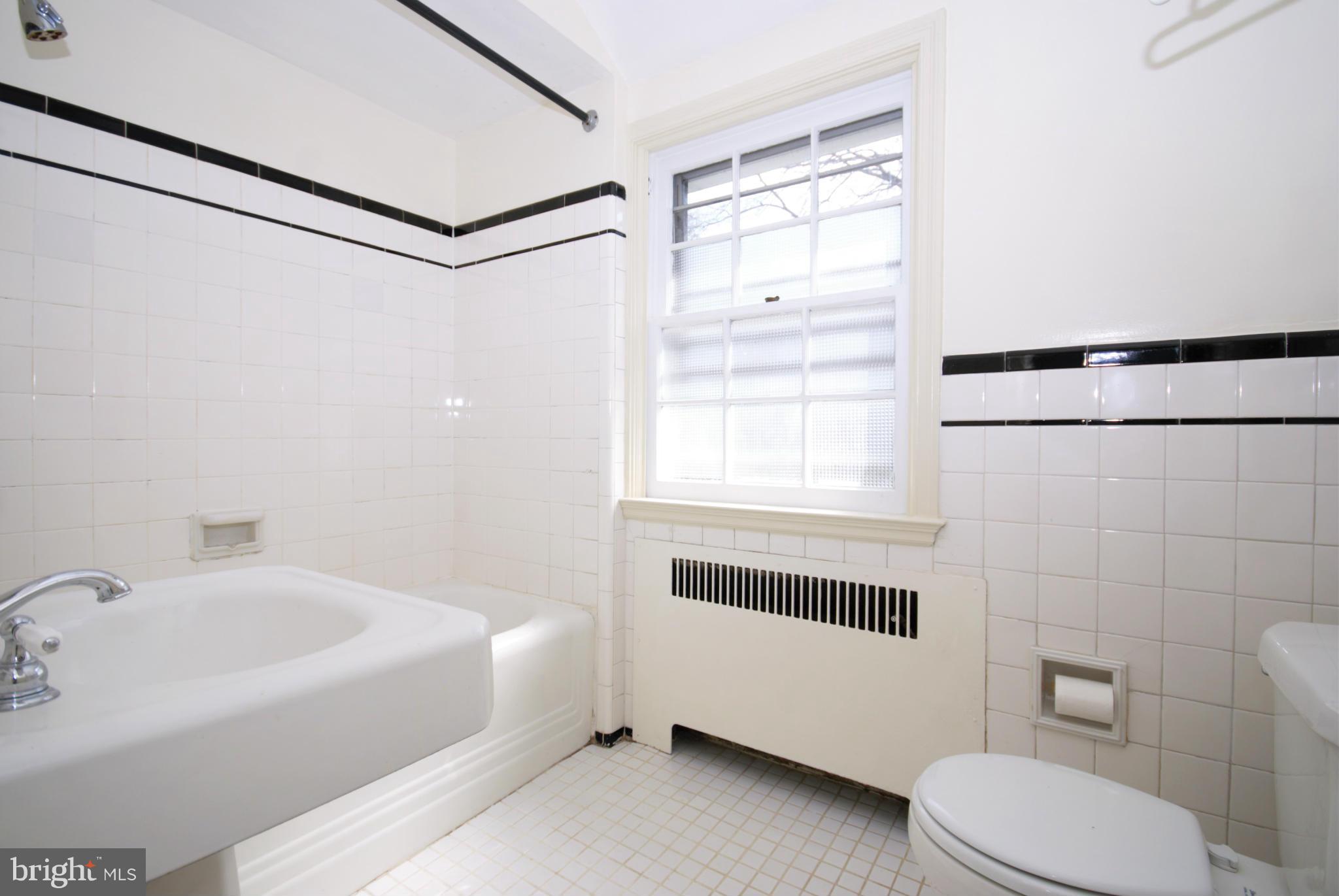 326 Paddington Road Baltimore, MD 21212 - Photo 18 of 29 a bathroom with a sink toilet and shower