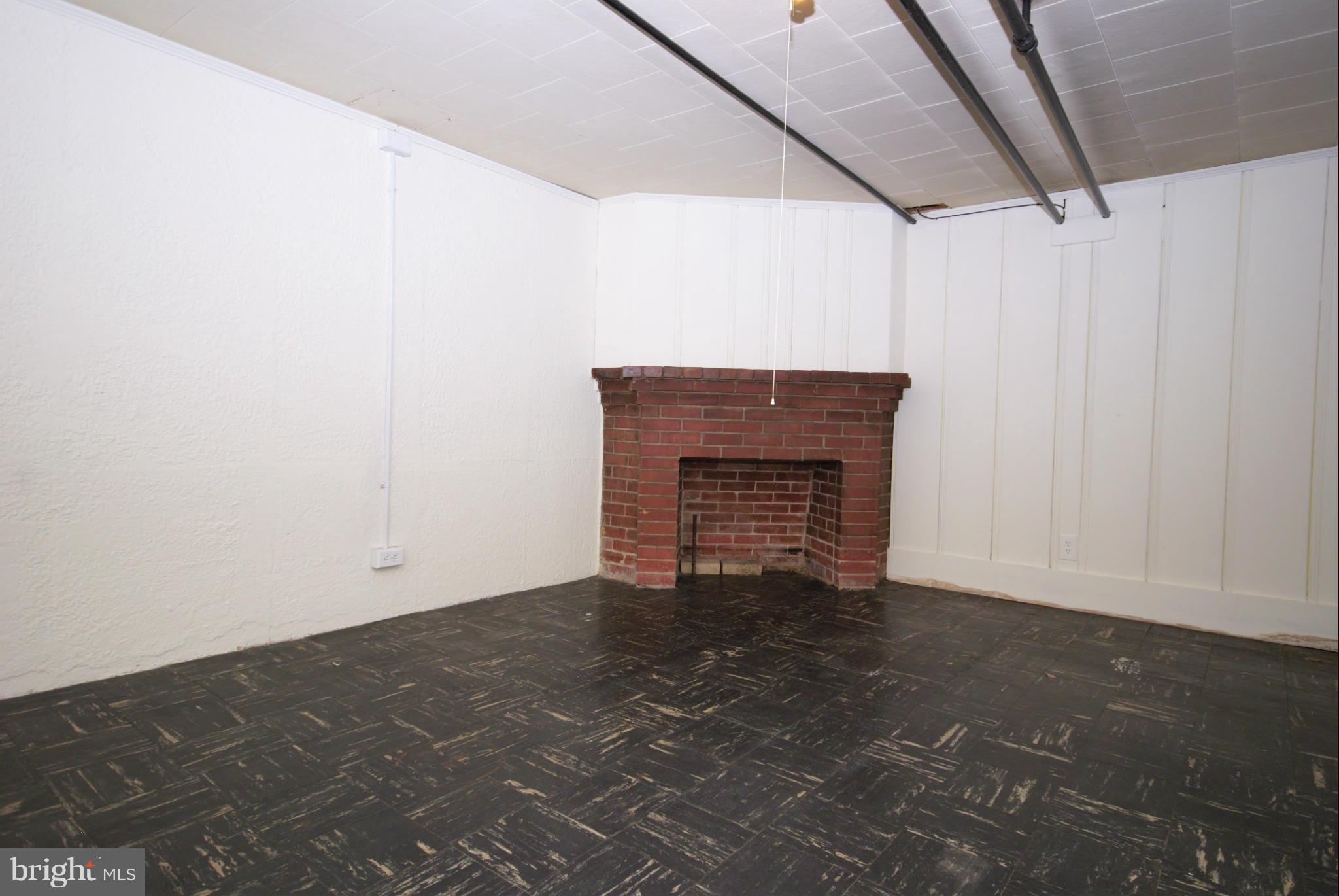 326 Paddington Road Baltimore, MD 21212 - Photo 21 of 29 a view of empty room with a fireplace