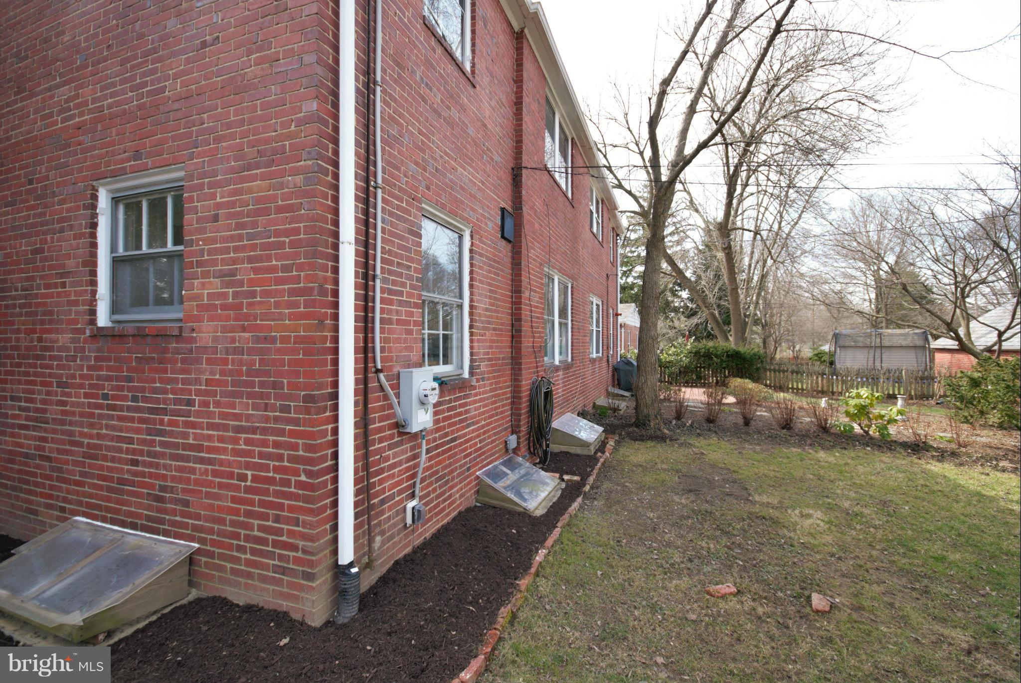 326 Paddington Road Baltimore, MD 21212 - Photo 26 of 29 a view of a brick house with a yard