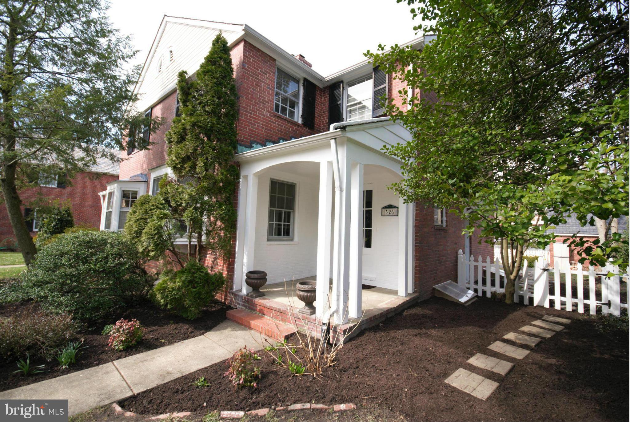 326 Paddington Road Baltimore, MD 21212 - Photo 4 of 29 a front view of a house with a yard