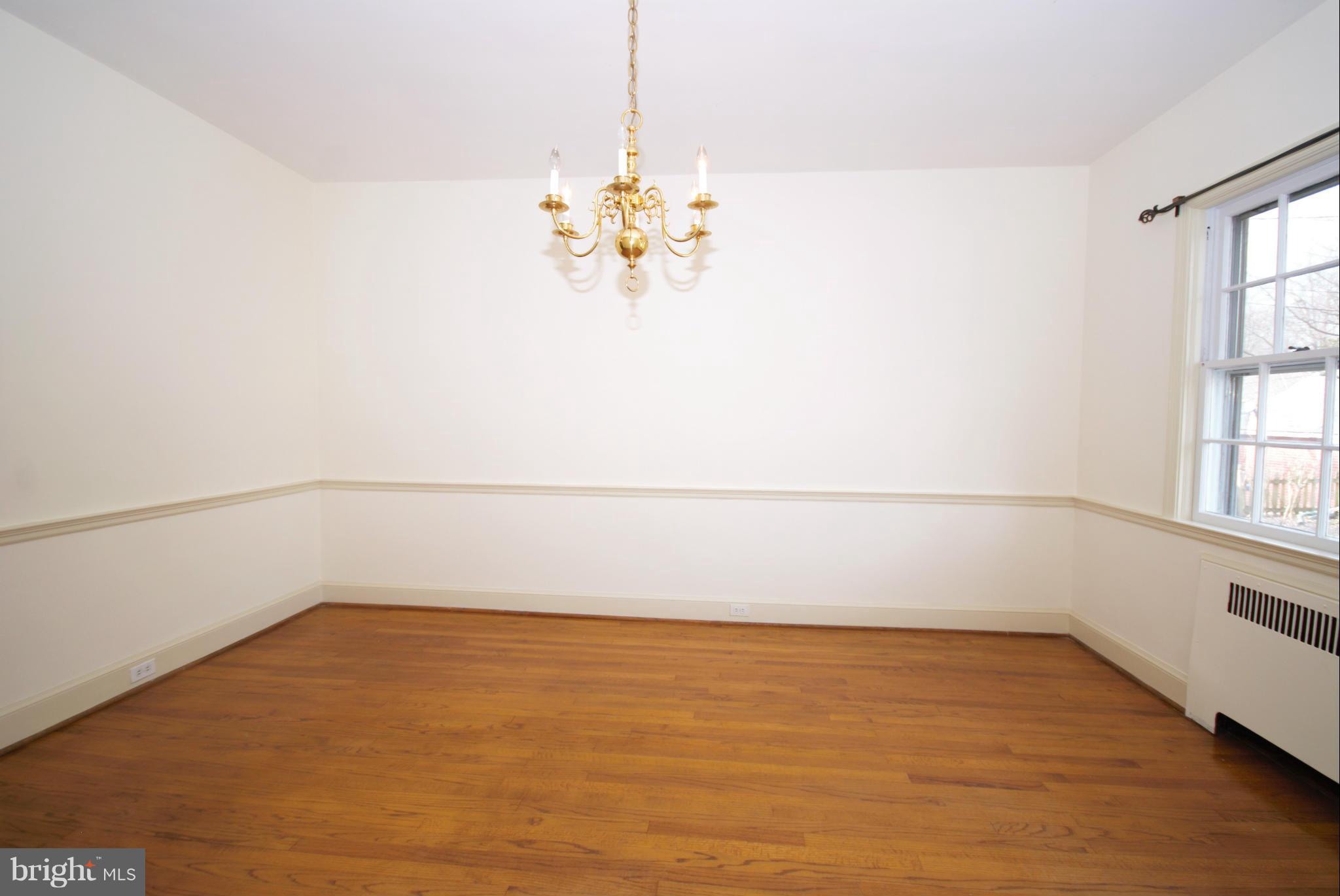 326 Paddington Road Baltimore, MD 21212 - Photo 7 of 29 a view of a room with rack on the wall and a window