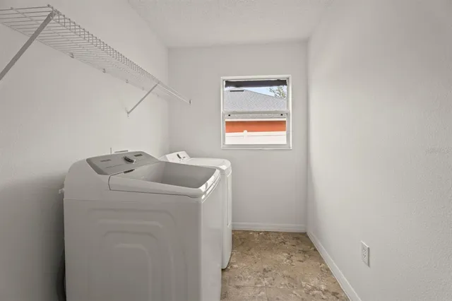 a bathroom with a tub shower and a sink