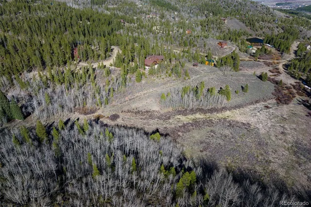 a view of outdoor space with trees all around