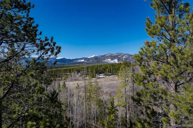 a view of a lake with a house in the background