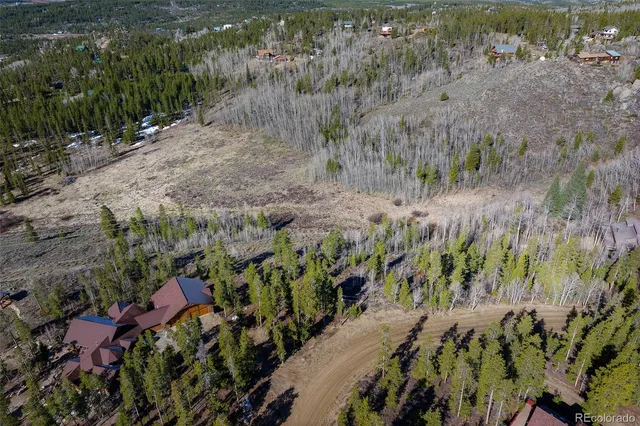 a view of a lake with top of forest