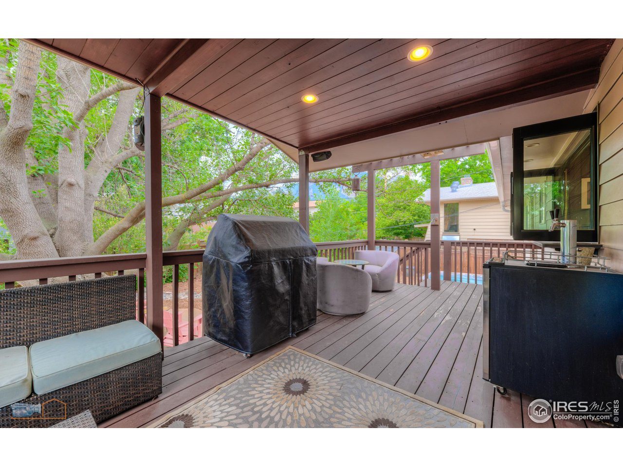 2850 Emerson Avenue Boulder, CO 80305 - Photo 15 of 40 a living room with large windows and furniture