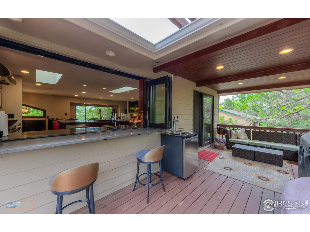2850 Emerson Avenue Boulder, CO 80305 - Photo 16 of 40 a living room with furniture and a large window