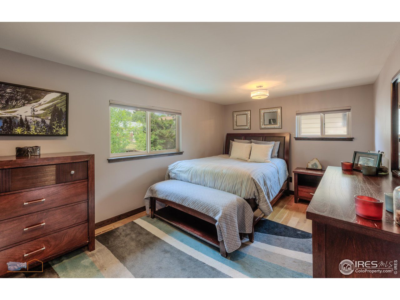 2850 Emerson Avenue Boulder, CO 80305 - Photo 17 of 40 a bedroom with a bed window and dresser