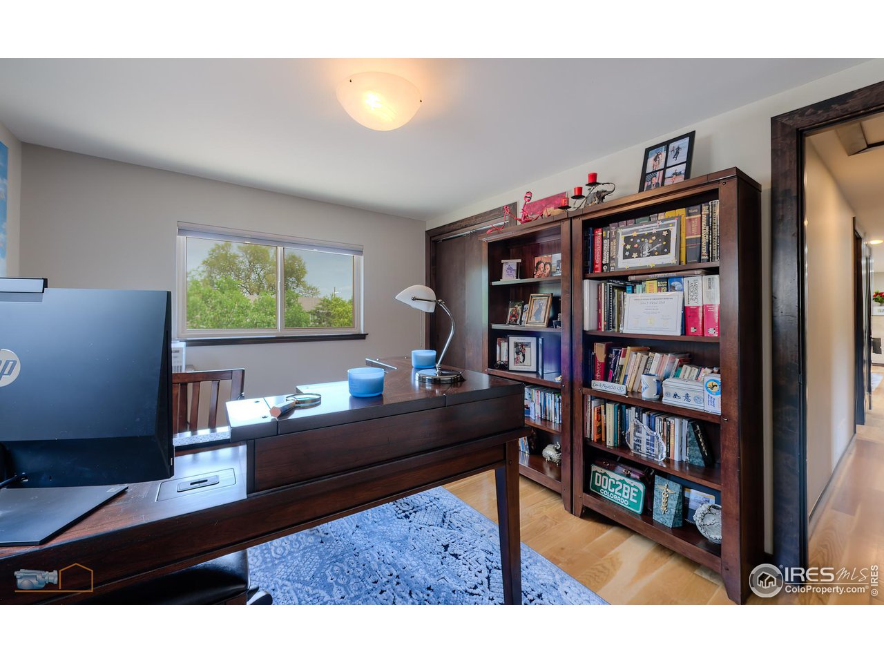 2850 Emerson Avenue Boulder, CO 80305 - Photo 20 of 40 a living room with furniture and a book shelf