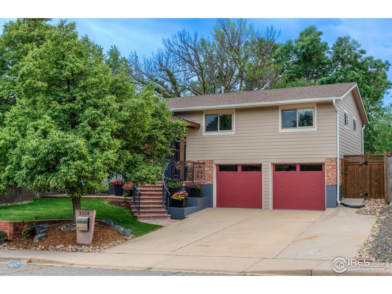 2850 Emerson Avenue Boulder, CO 80305 - Photo 2 of 40 a front view of a house with a yard