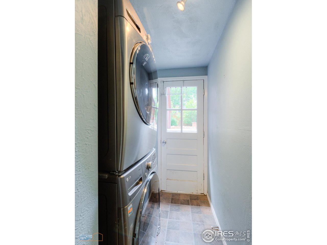 2850 Emerson Avenue Boulder, CO 80305 - Photo 23 of 40 a view of a hallway with washer and dryer