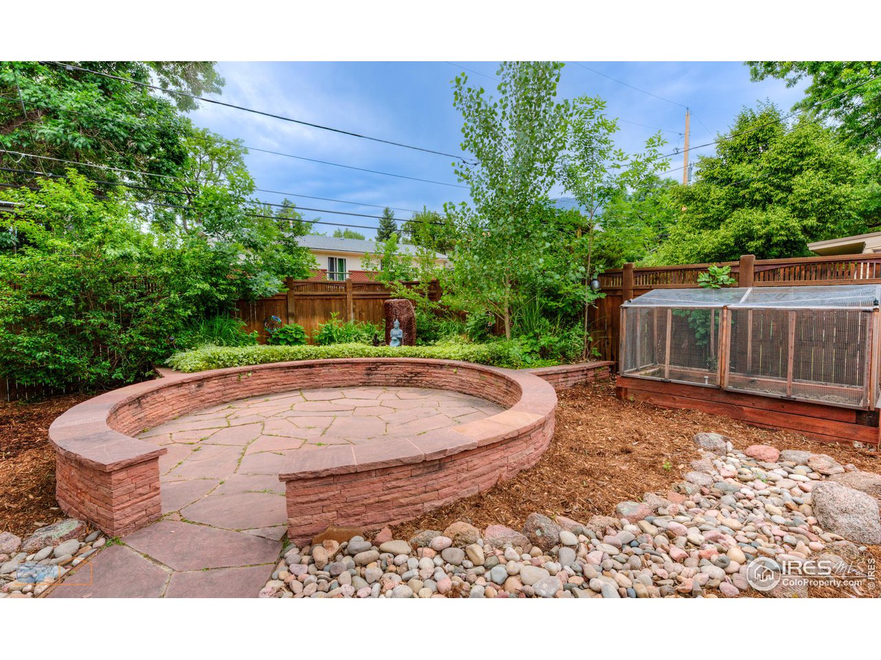 2850 Emerson Avenue Boulder, CO 80305 - Photo 32 of 40 a backyard of a house with yard and outdoor seating
