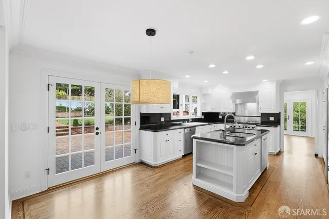 a living room with a fireplace and a floor to ceiling window