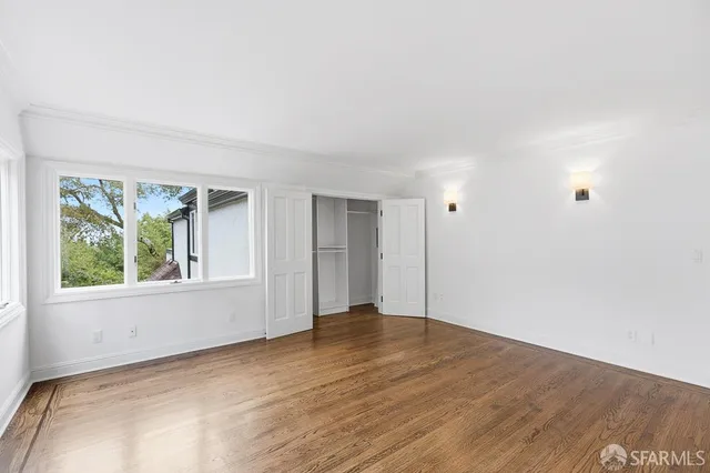 a bathroom with a glass shower door and a glass door