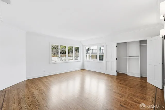 a kitchen with granite countertop a sink and a refrigerator