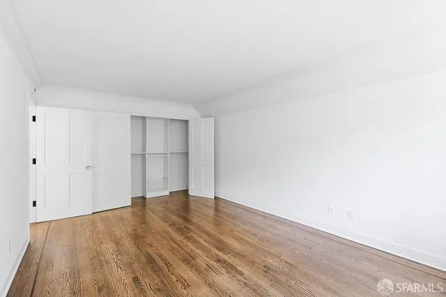 a bathroom with a double vanity sink toilet mirror and shower