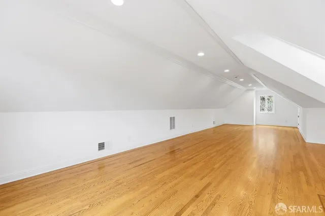 a kitchen with granite countertop stainless steel appliances a refrigerator sink and microwave