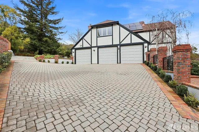 an empty room with wooden floor and fireplace