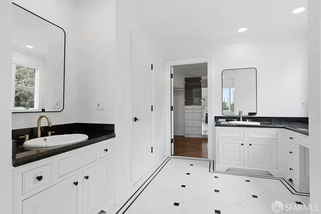 a view of a patio with chairs and potted plants