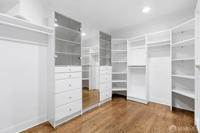 a view of a garden with a house in the background