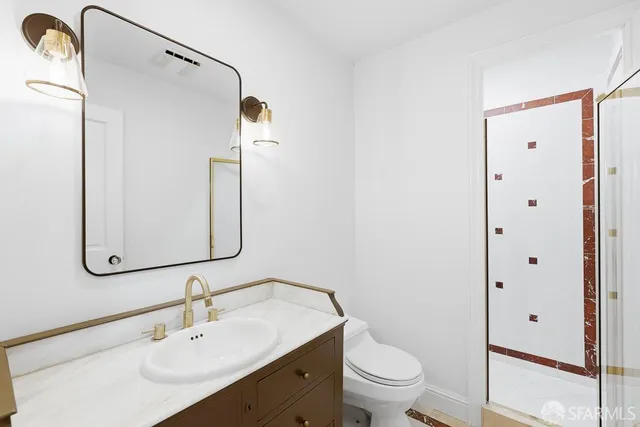 an aerial view of a house with garden space and street view