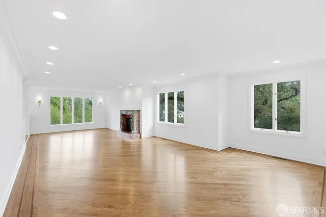 a kitchen with stainless steel appliances a refrigerator sink and stove top oven