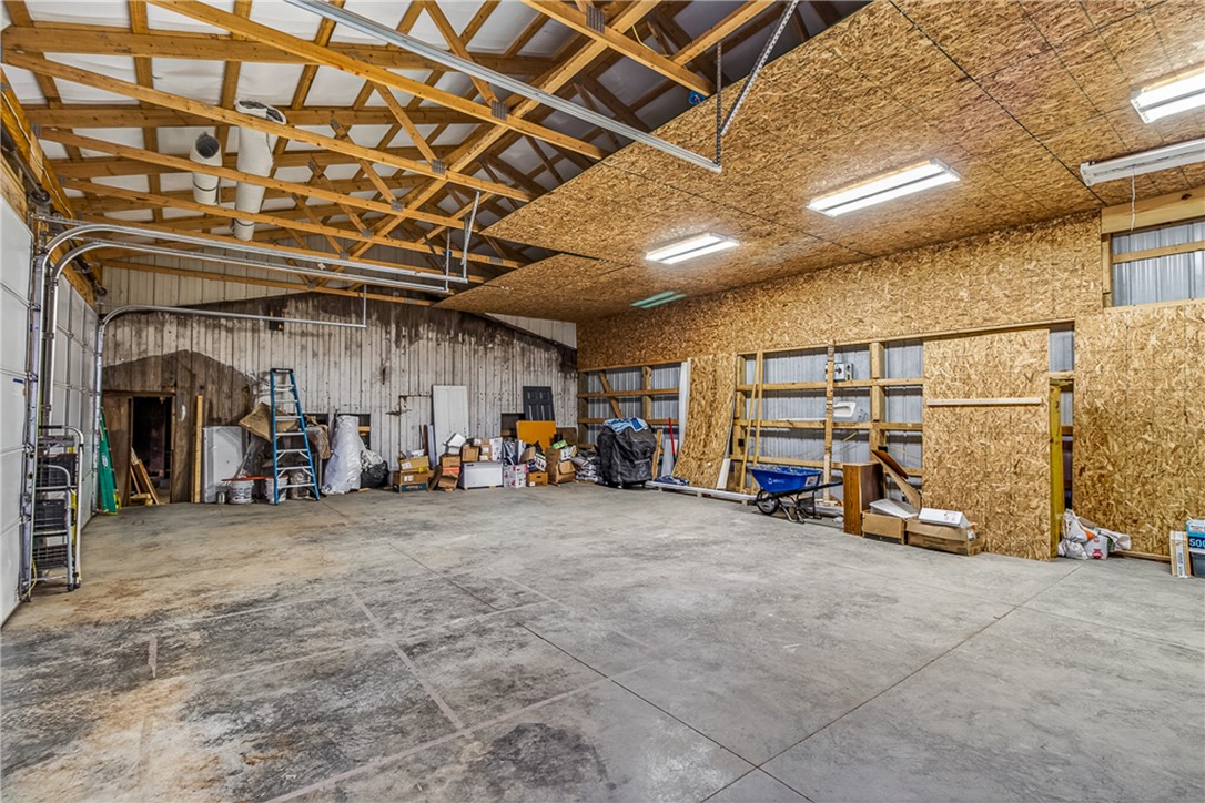 8700 Quaker Trace Road Camden, OH 45311 - Photo 30 of 34 This spacious garage offers abundant storage and functional space.