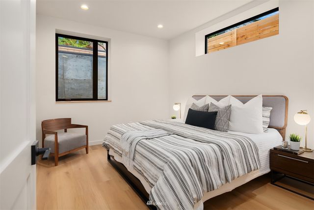a bathroom with a sink mirror vanity and toilet