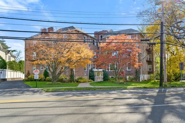 a view of a street with a building in the background