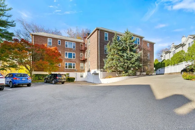 a bedroom with a bed and a dresser in it