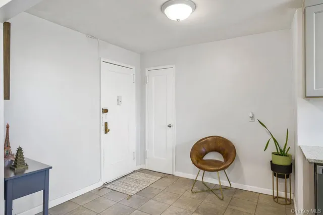 a view of an empty room and wooden floor