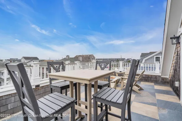 a view of a balcony with furniture