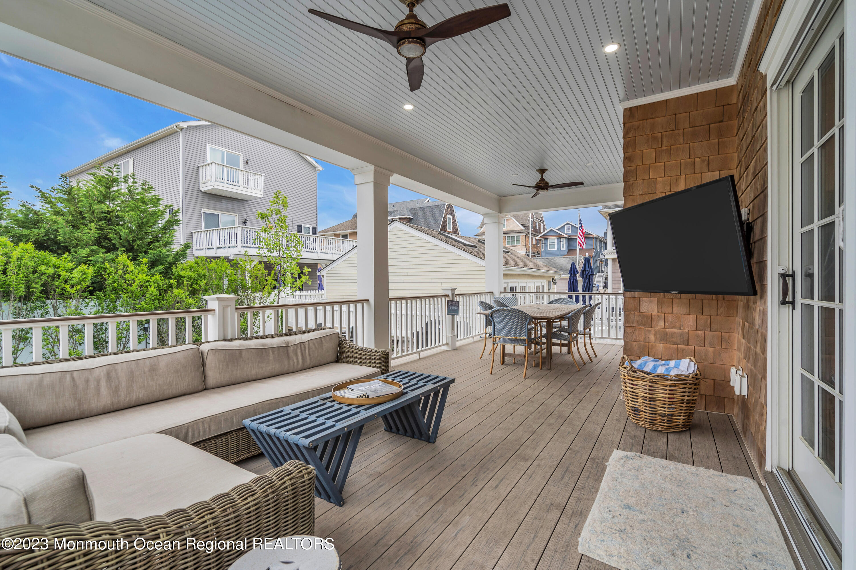 32 3rd Avenue Lavallette, NJ 08735 - Photo 4 of 12 a living room with furniture and a flat screen tv