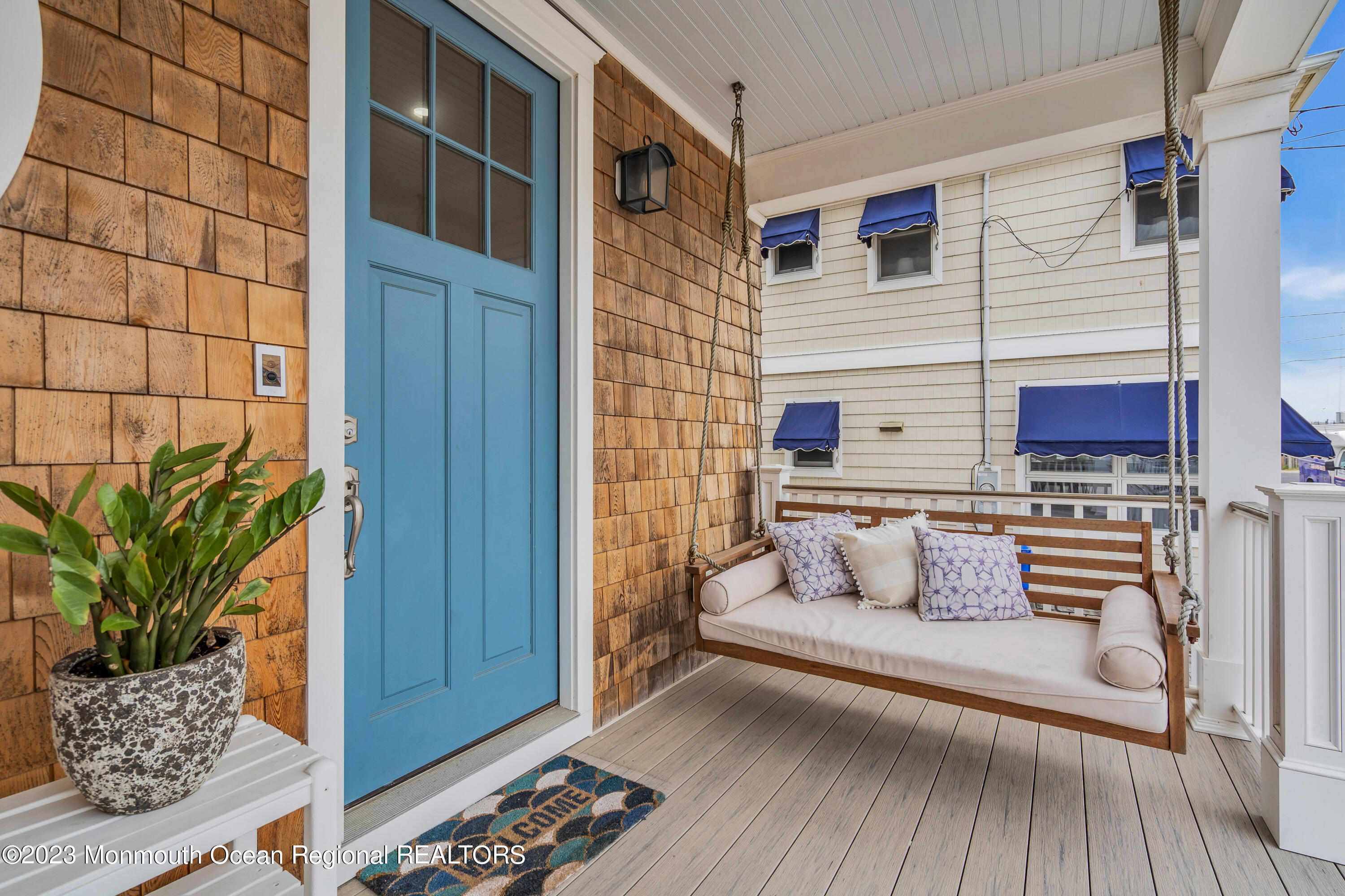 32 3rd Avenue Lavallette, NJ 08735 - Photo 9 of 12 a view of a house with a balcony and wooden floor