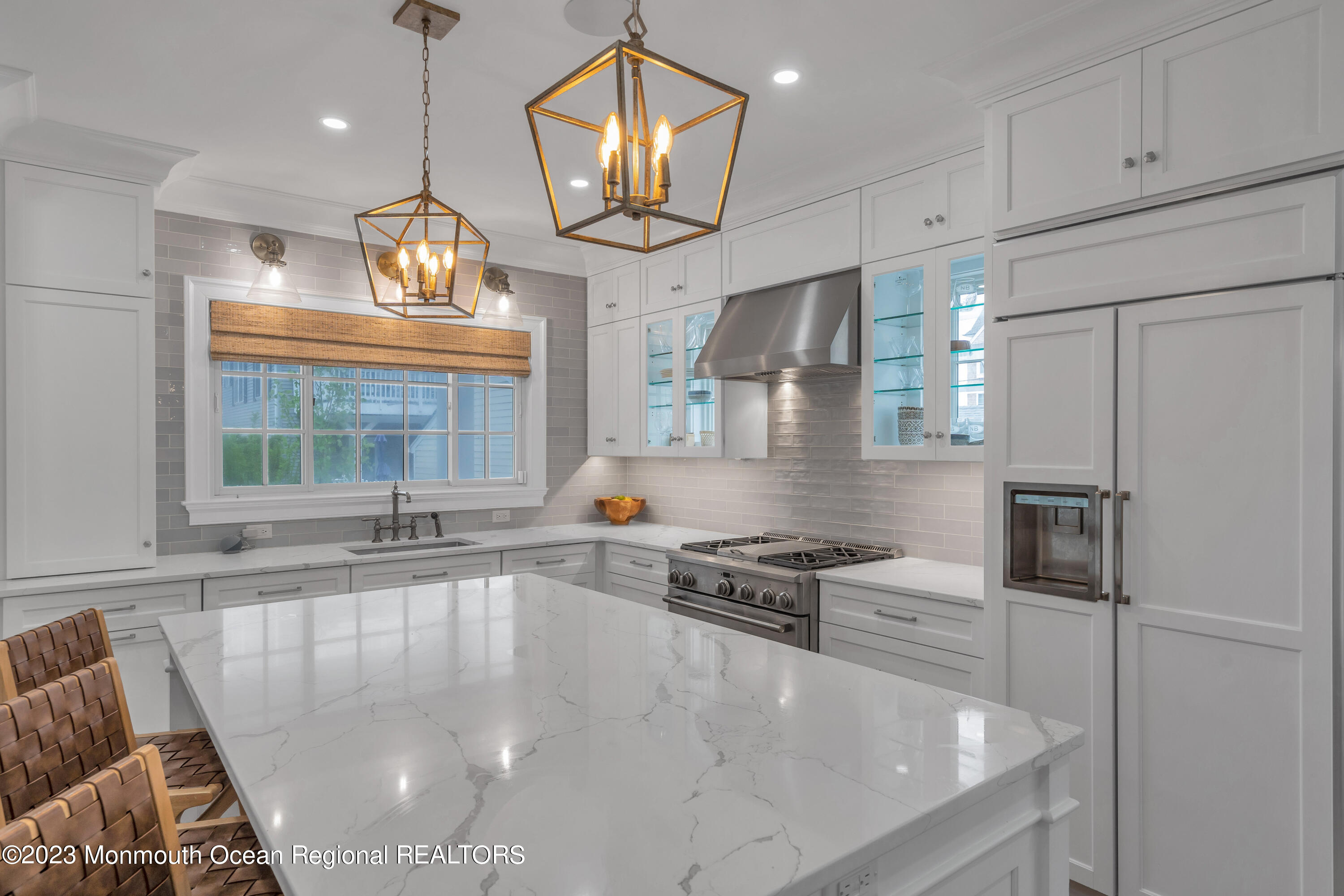 32 3rd Avenue Lavallette, NJ 08735 - Photo 10 of 12 a large kitchen with stainless steel appliances a large counter top a stove and a window