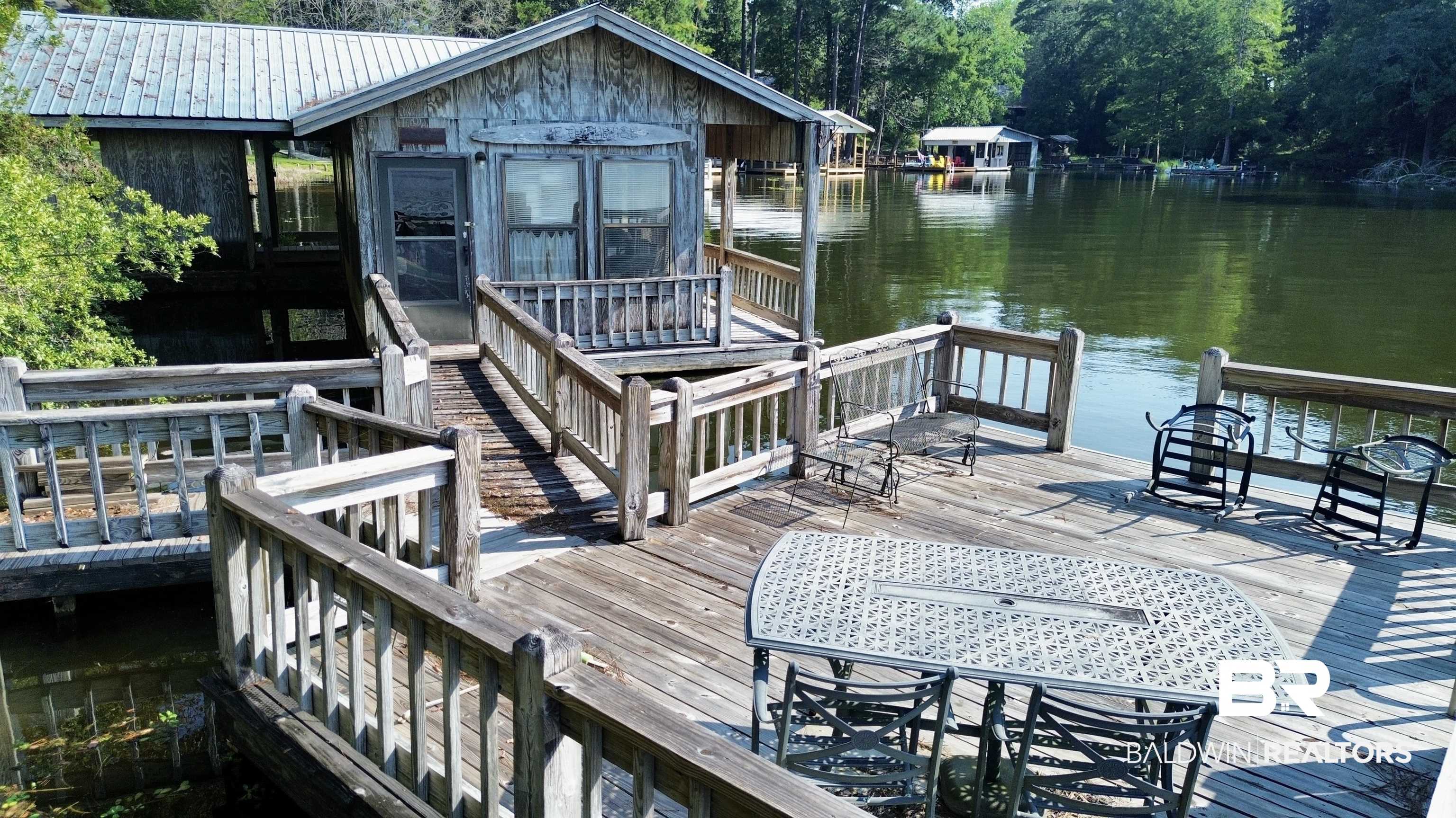 0 Twin Oaks Road Andalusia, AL 36421 - Photo 6 of 7 Dock area with a deck with water view and a sunroom