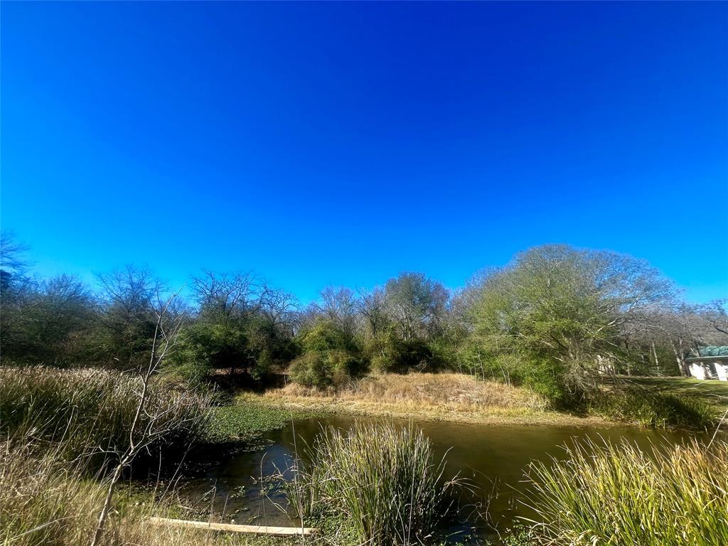799 LCR 799, Unit 2 Groesbeck, TX 76642 - Photo 1 of 9 a view of lake background with houses