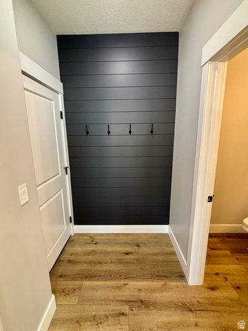 1184 West 3250 North Ogden, UT 84414 - Photo 17 of 69 Accent wall featuring horizontal paneling and four black hooks