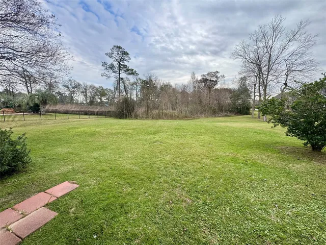 a view of a field with an trees