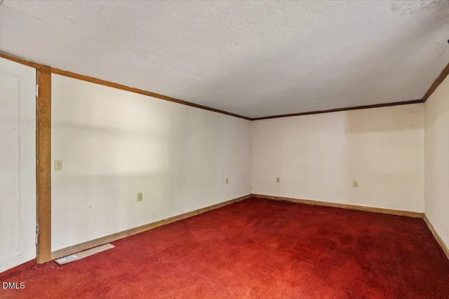 a view of empty room with windows