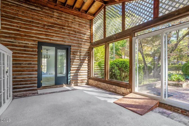 a view of a house with wooden deck
