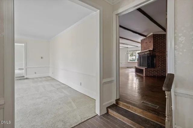a view of livingroom with hardwood floor and kitchen