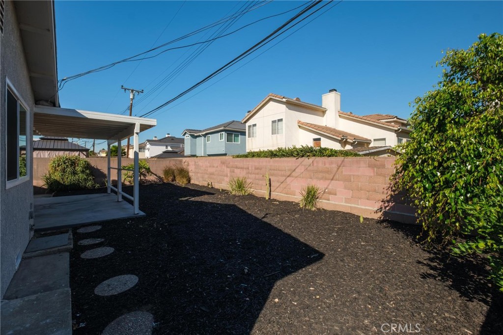 1613 West Piru Street Compton, CA 90222 - Photo 12 of 40 a front view of a house with yard