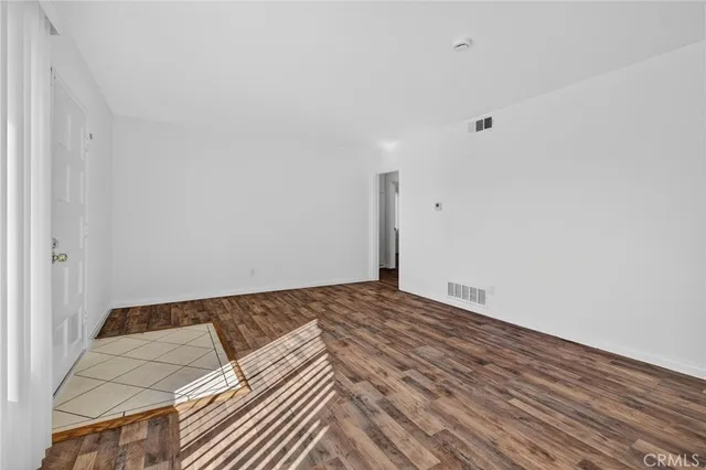 a view of closet with wooden floor