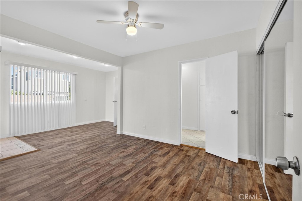 1613 West Piru Street Compton, CA 90222 - Photo 26 of 40 wooden floor in an empty room with a window