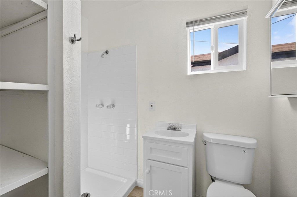 1613 West Piru Street Compton, CA 90222 - Photo 30 of 40 a bathroom with a toilet and a shower