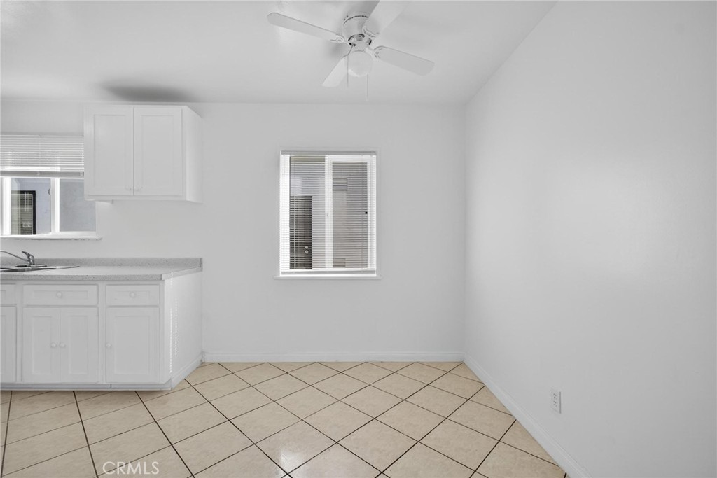 1613 West Piru Street Compton, CA 90222 - Photo 39 of 40 a bathroom with a sink vanity and a window