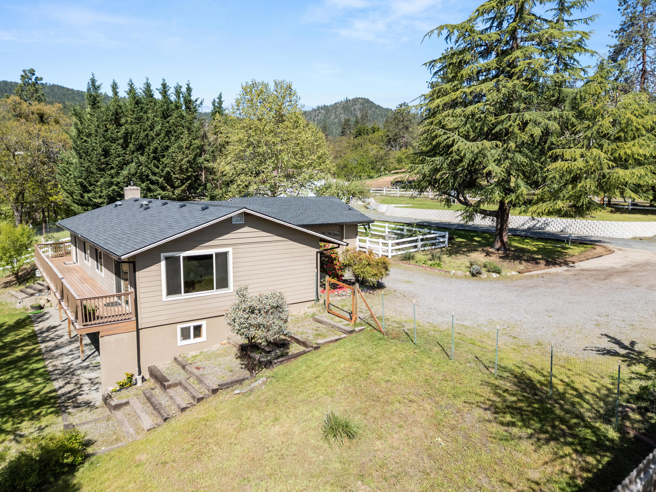 3583 Ross Lane Central Point, OR 97502 - Photo 43 of 52 a house with trees in the background