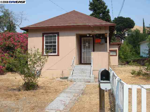 a front view of a house with yard