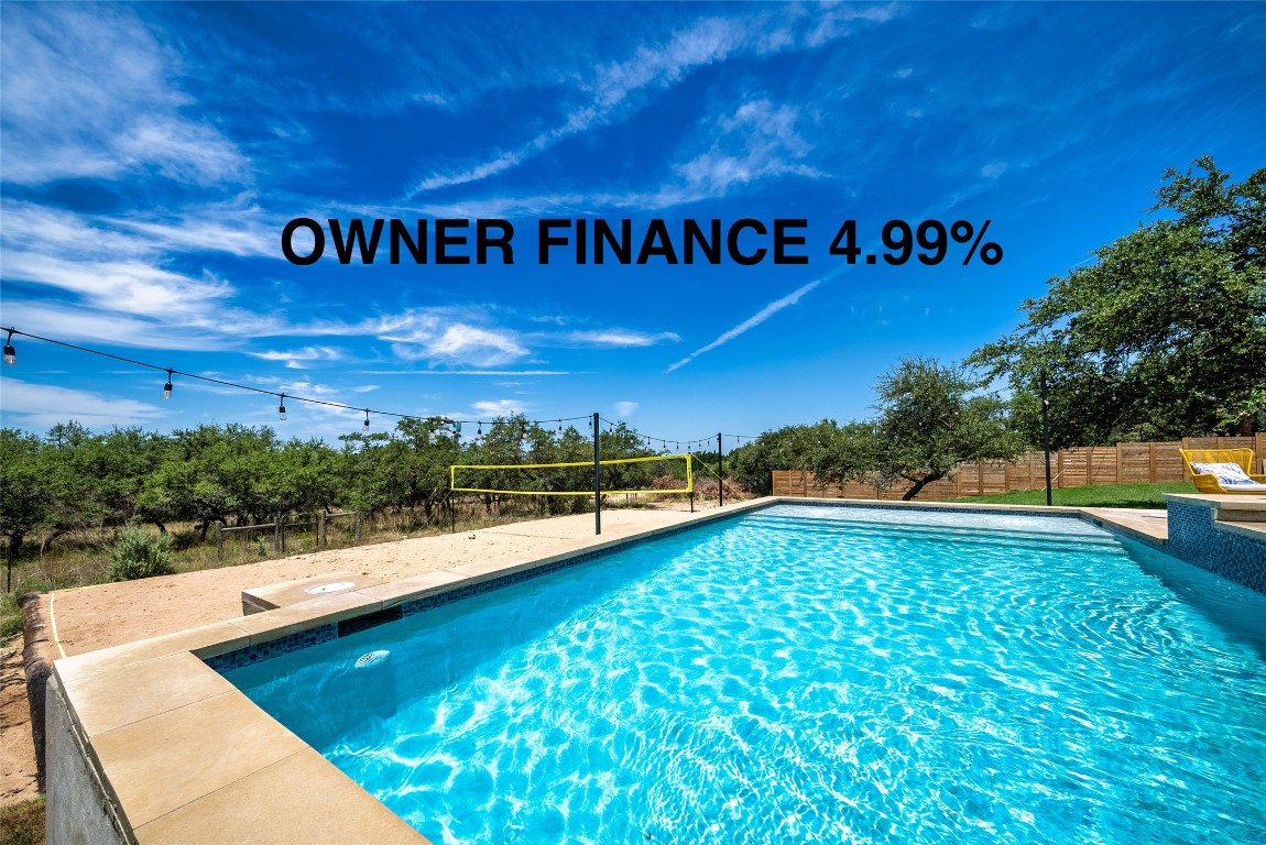 a view of swimming pool with a yard